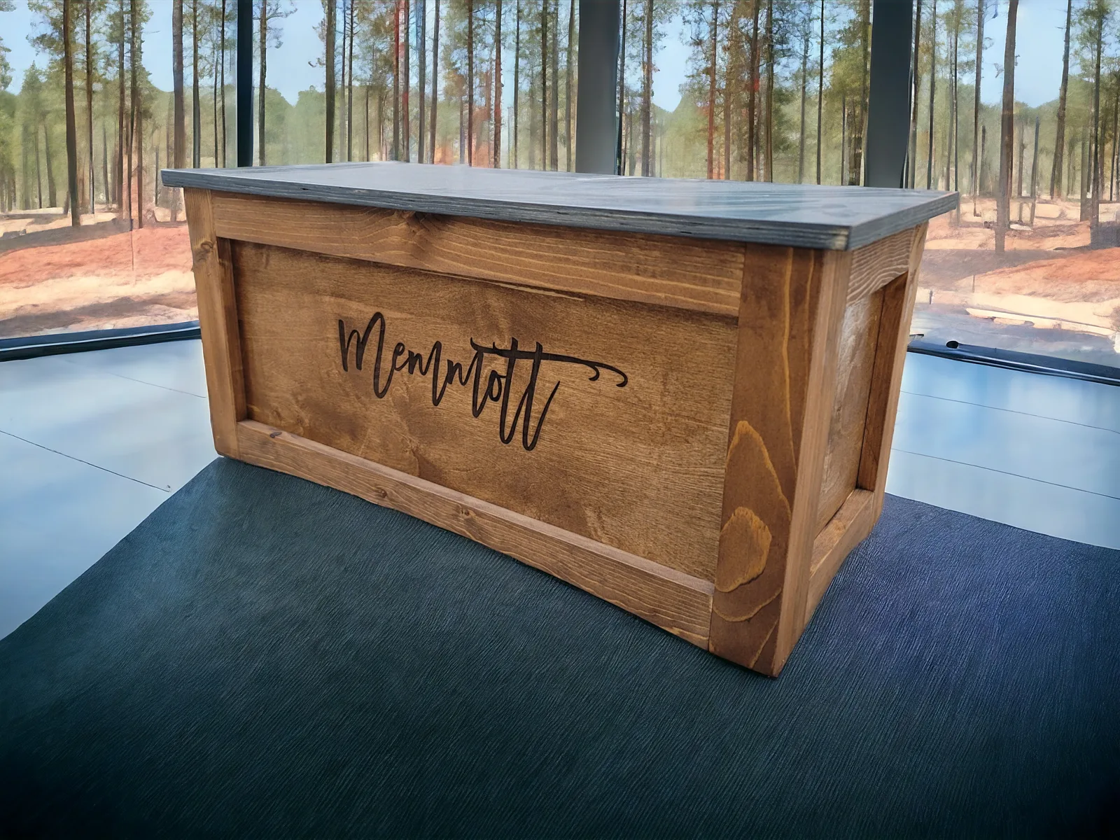 Toy box engraved "Memmott", Early American with a Phantom Gray lid, in a room with a forest view